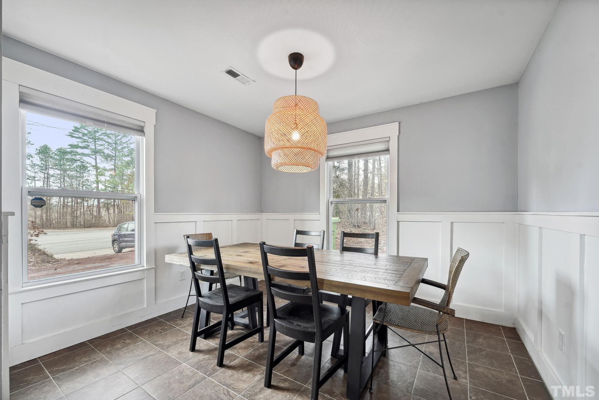 5218 Duraleigh Road Raleigh, NC 27612 - Photo 5 of 27 a view of a dining room with furniture window and outside view