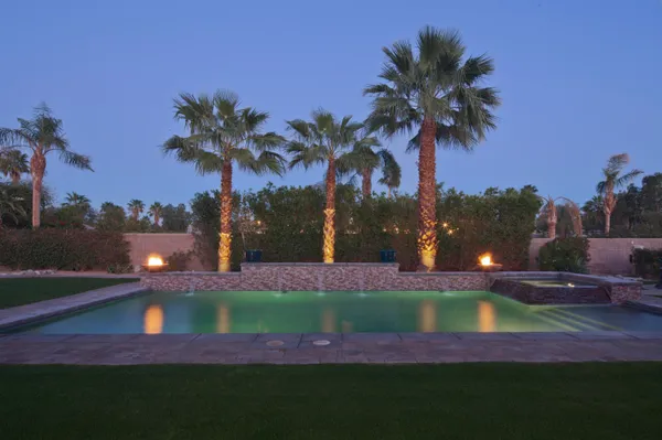 a view of a yard with a swimming pool