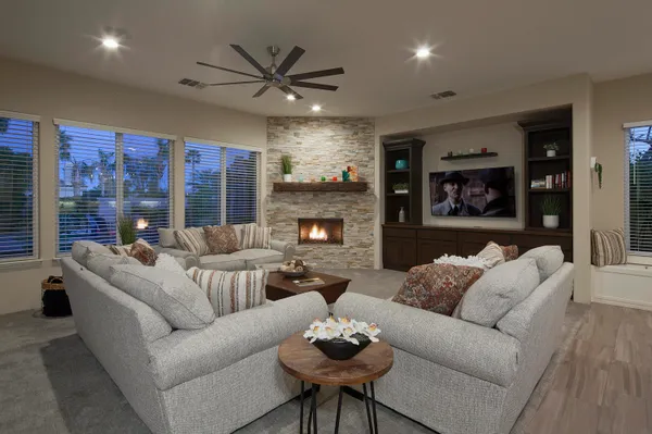 a living room with furniture and a fireplace