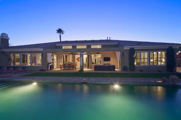 a view of building with river in front of it