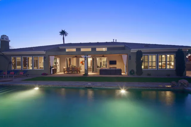 a view of building with river in front of it