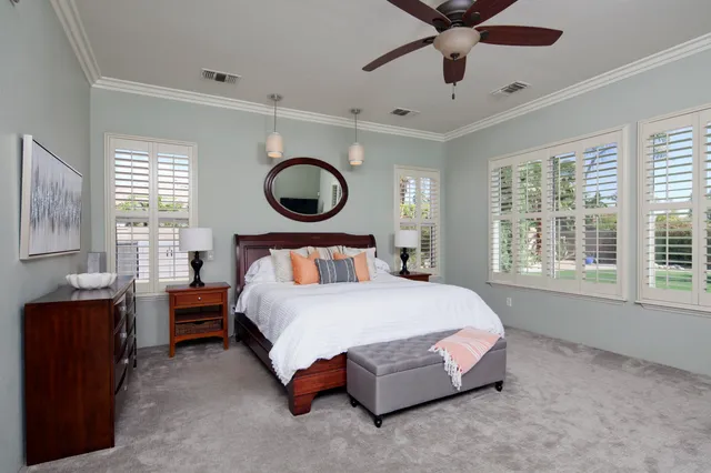 a spacious bathroom with a double vanity sink a mirror and a bathtub