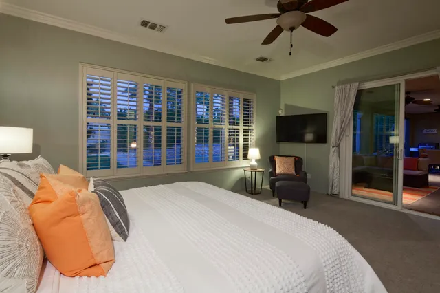 a bathroom with a double vanity sink mirror and shower