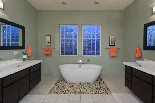 a view of a swimming pool with a garden and plants