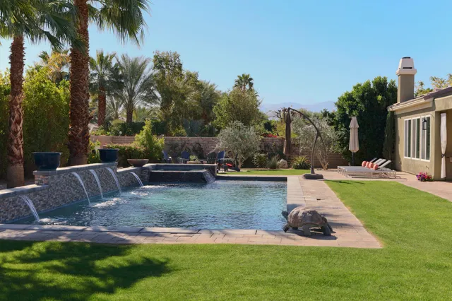 a view of a dining table and chairs in the patio