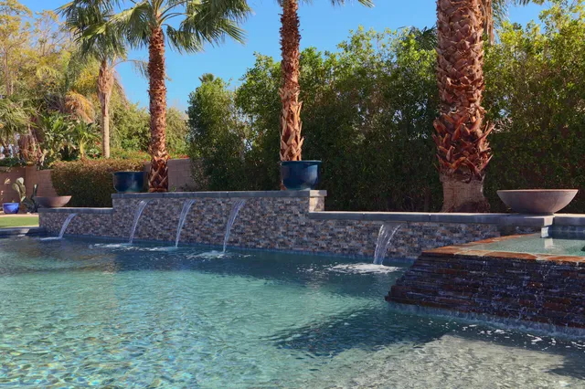 a view of a backyard with a fountain
