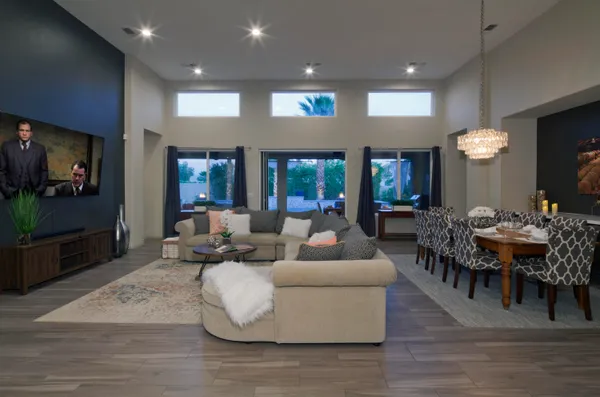 a living room with fireplace furniture and a flat screen tv