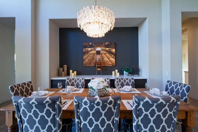 a balcony with furniture and chandelier
