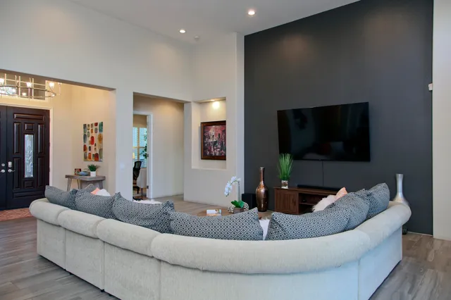 a living room with furniture and a flat screen tv