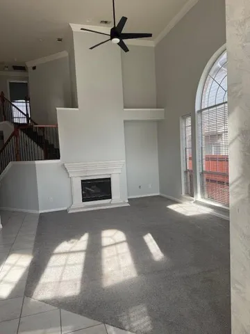 a kitchen with granite countertop a sink a stove and cabinets