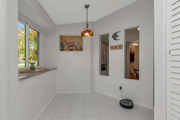 a view of a hallway with paintings on wall