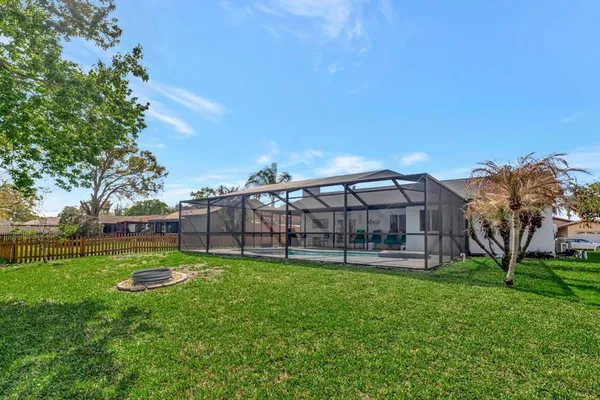 a view of a house with a backyard porch and sitting area