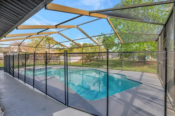 a view of outdoor space with swimming pool and sitting area