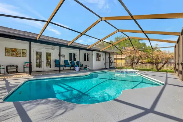 a view of a swimming pool with a patio