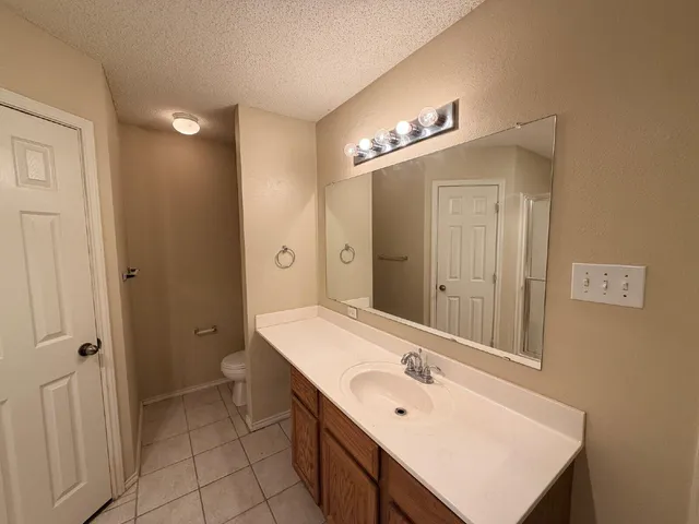 a bathroom with a sink a double vanity and a mirror