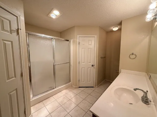 a bathroom with a tub and shower
