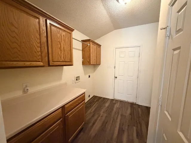 a room with a sink and cabinets