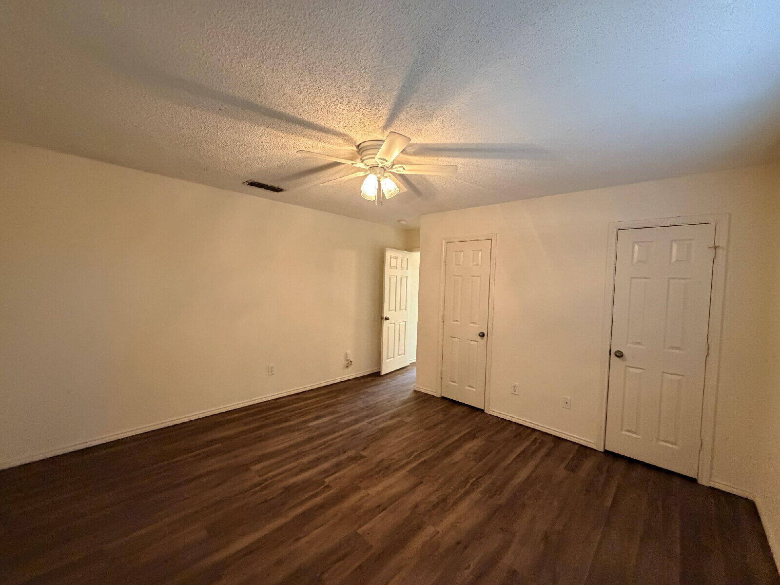 6126 16th Street Lubbock, TX 79416 - Photo 6 of 17 wooden floor in an empty room