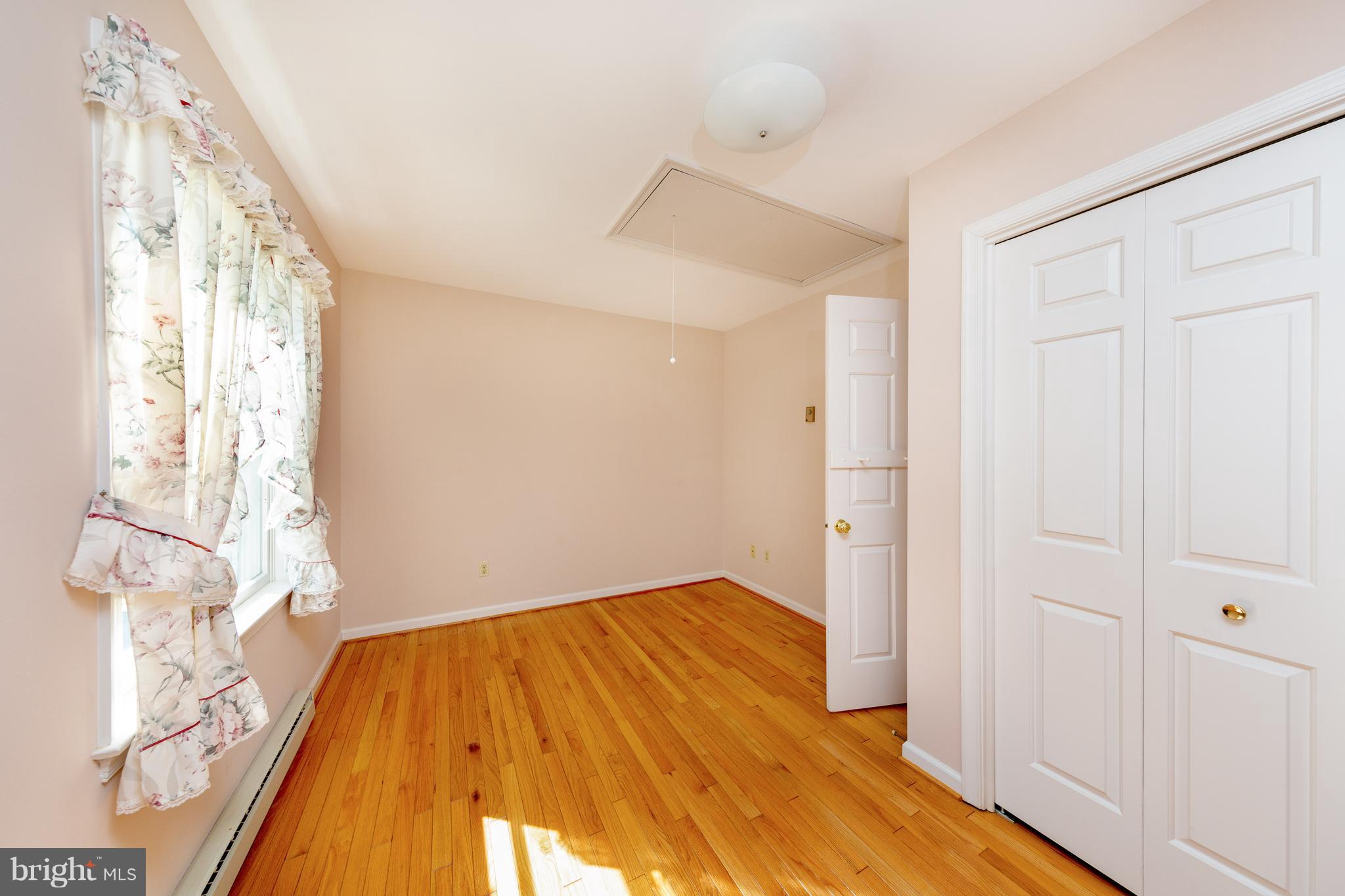 18257 Falls Road Hampstead, MD 21074 - Photo 14 of 49 a view of empty room with wooden floor and fan