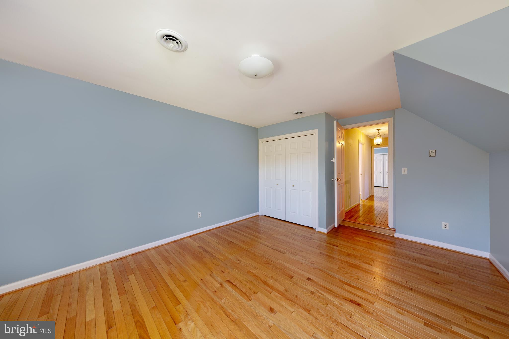 18257 Falls Road Hampstead, MD 21074 - Photo 16 of 49 a view of an empty room and wooden floor