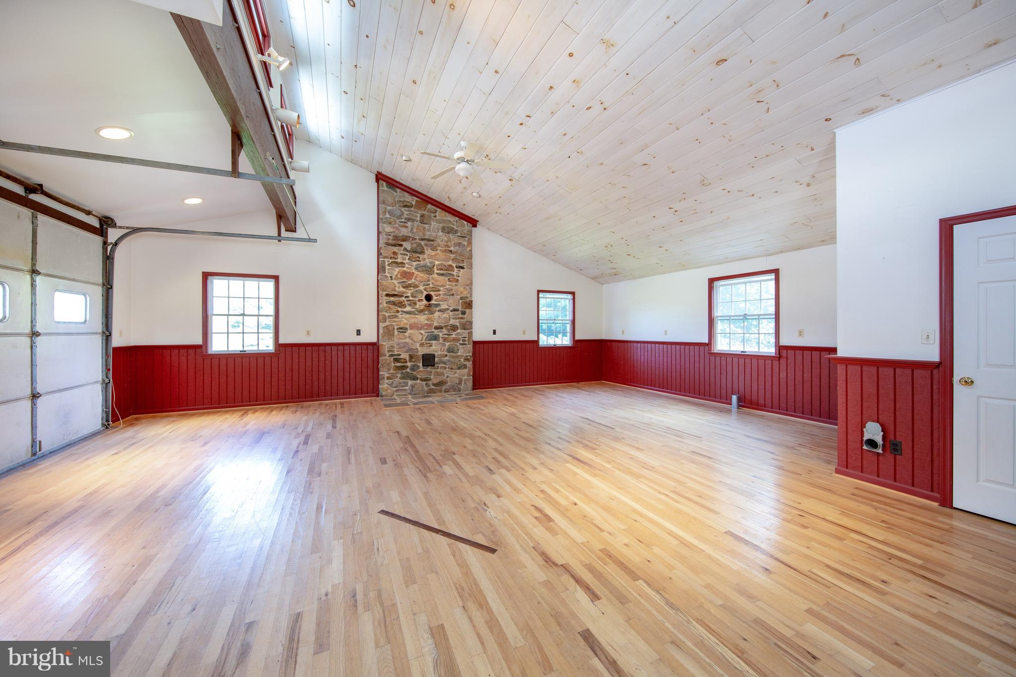 18257 Falls Road Hampstead, MD 21074 - Photo 28 of 49 a large bedroom with wooden floor and windows