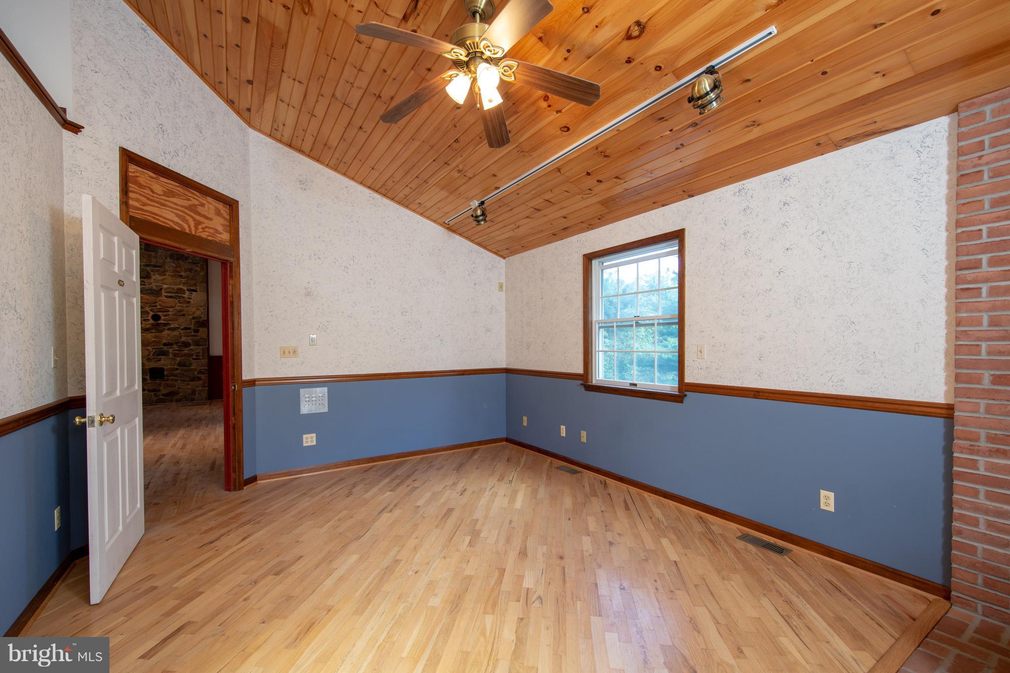 18257 Falls Road Hampstead, MD 21074 - Photo 30 of 49 a view of room with window and hardwood floor