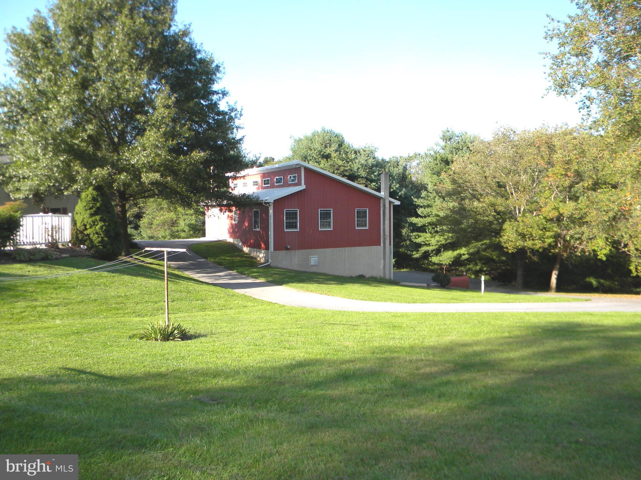 18257 Falls Road Hampstead, MD 21074 - Photo 36 of 49 a view of a house with a backyard