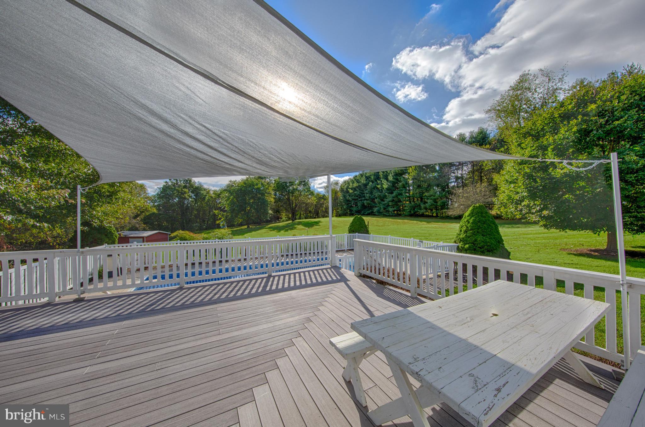 18257 Falls Road Hampstead, MD 21074 - Photo 39 of 49 a view of a roof deck with wooden floor and fence