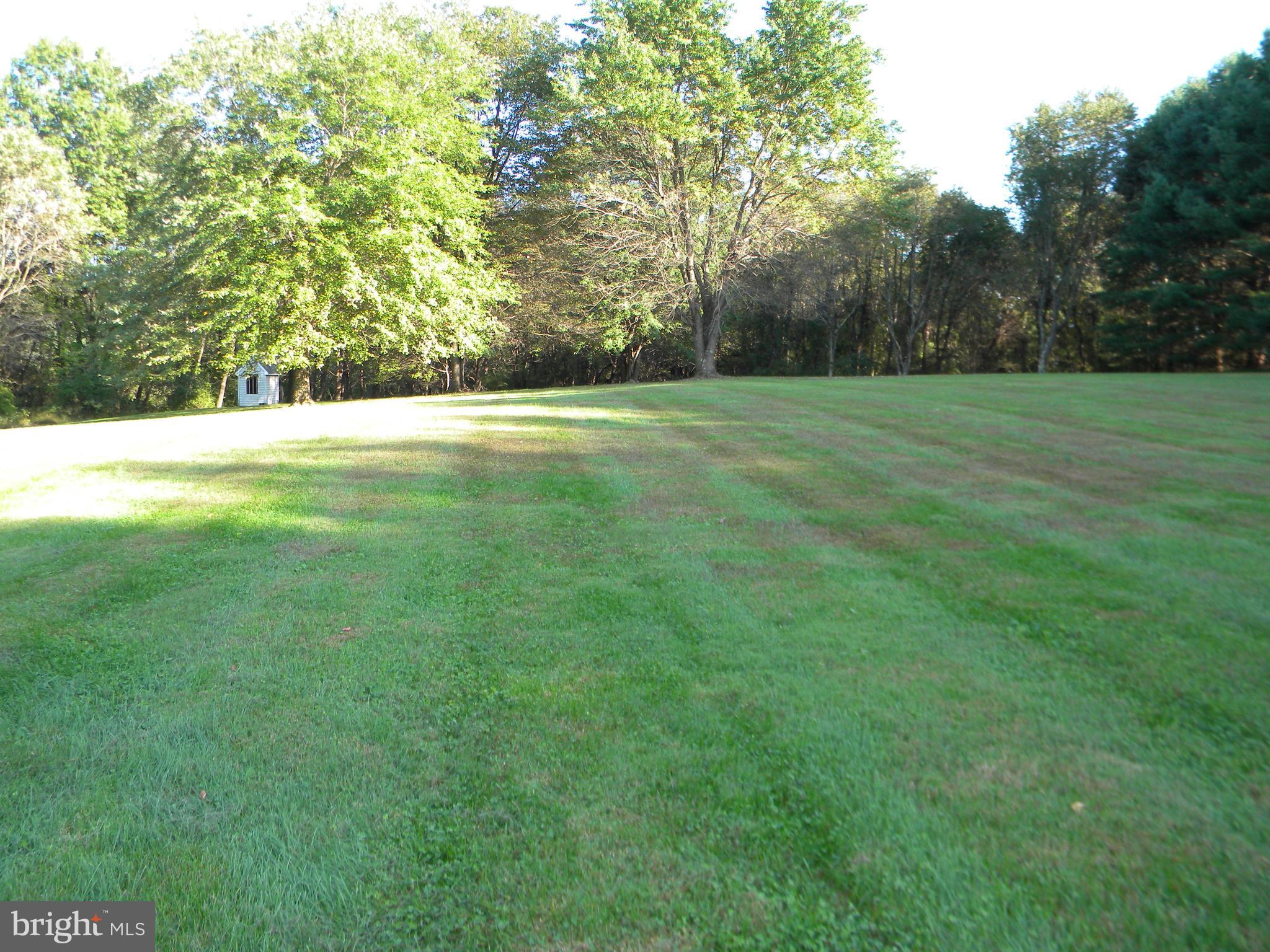 18257 Falls Road Hampstead, MD 21074 - Photo 48 of 49 a view of a field with trees in the background