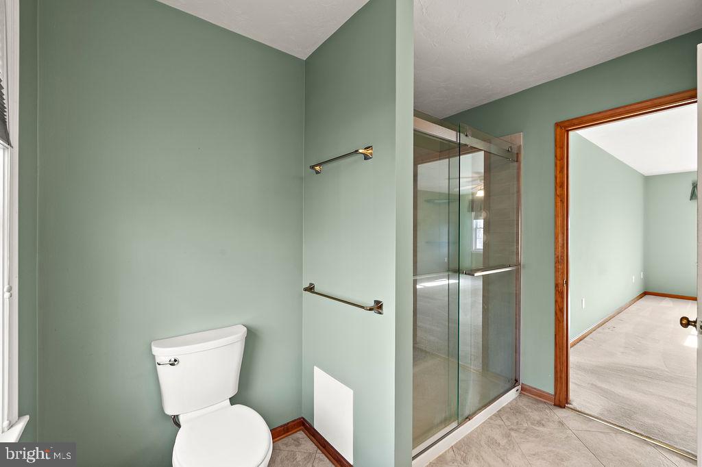 105 Round Top Lane Gettysburg, PA 17325 - Photo 33 of 50 a white toilet sitting next to a bathroom sink