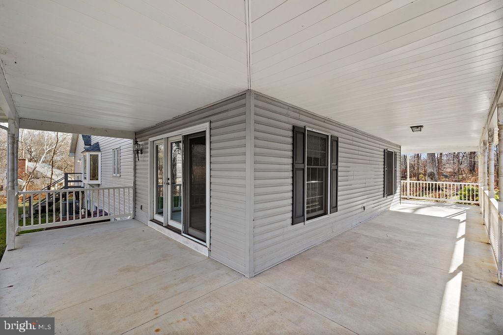 105 Round Top Lane Gettysburg, PA 17325 - Photo 9 of 50 a view of a porch with furniture and floor to ceiling window