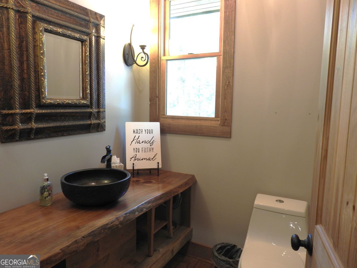 366 Shepherds Lane Morganton, GA 30560 - Photo 22 of 77 a bathroom with a toilet a sink and a mirror
