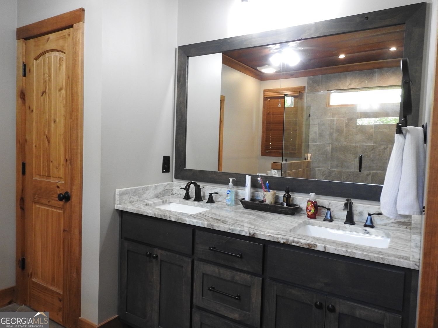 366 Shepherds Lane Morganton, GA 30560 - Photo 27 of 77 a bathroom with a granite countertop sink double vanity and a mirror
