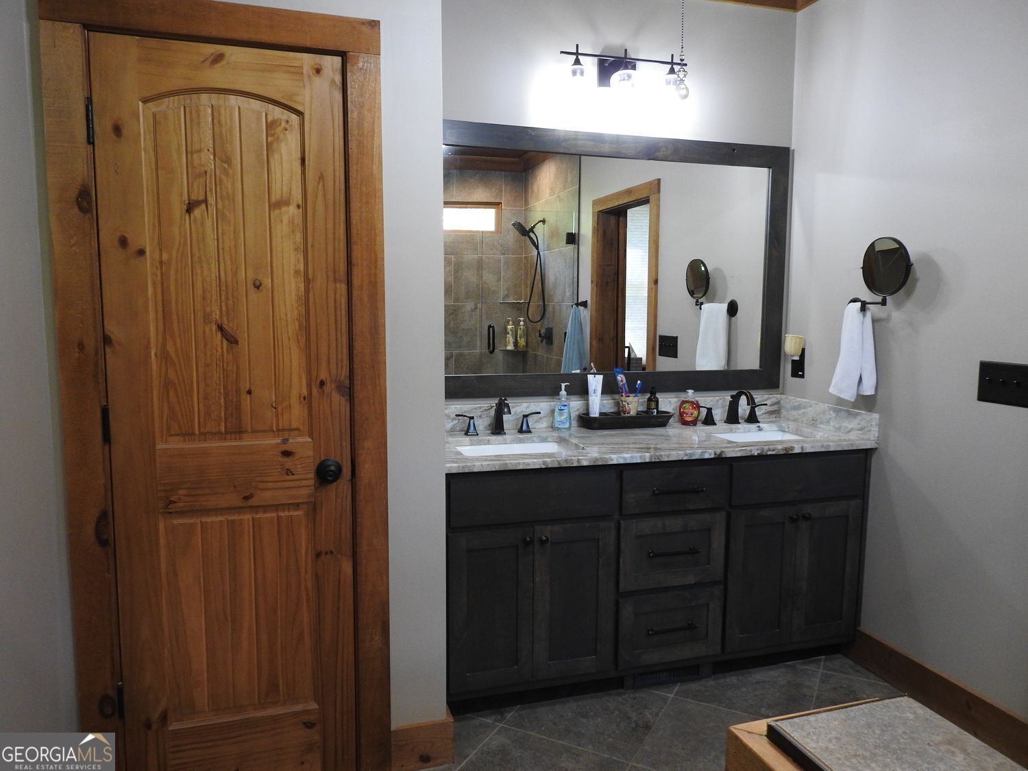 366 Shepherds Lane Morganton, GA 30560 - Photo 31 of 77 a bathroom with a double vanity sink and a mirror
