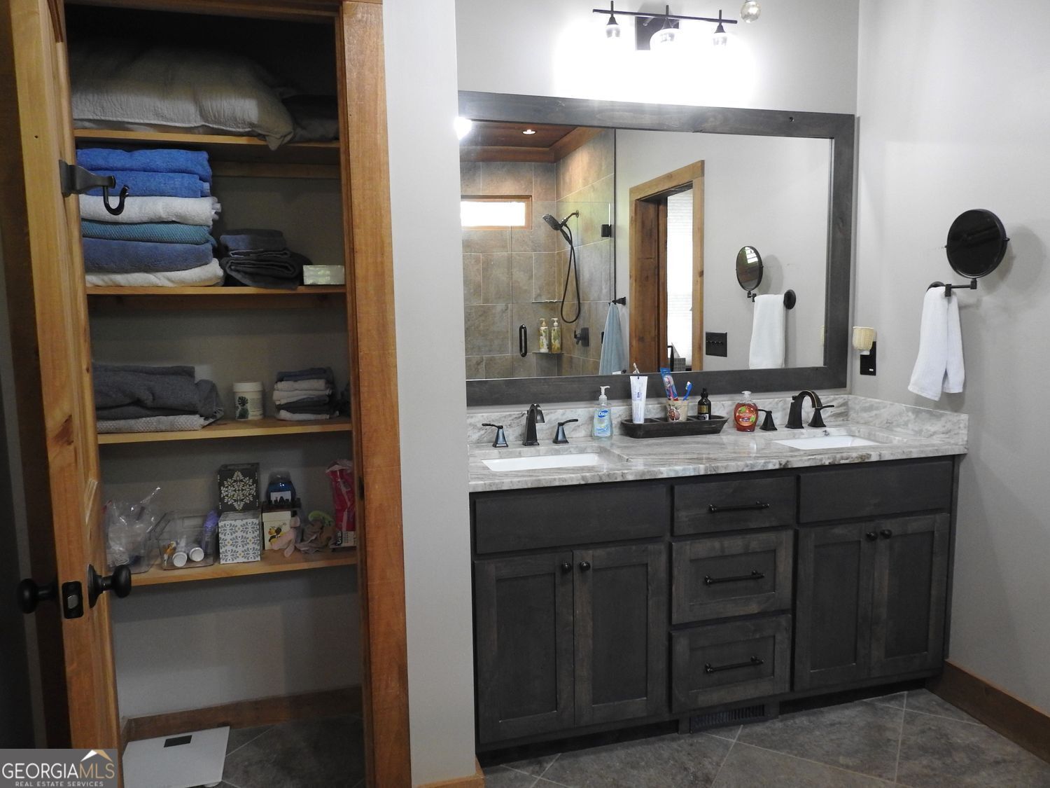 366 Shepherds Lane Morganton, GA 30560 - Photo 35 of 77 a bathroom with a double vanity sink and a mirror