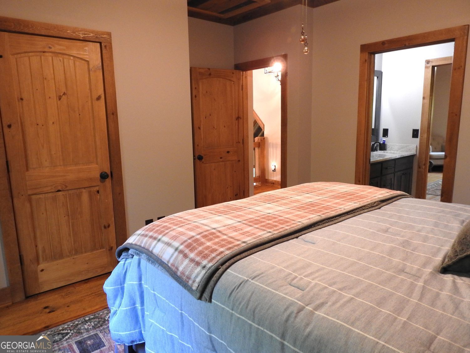 366 Shepherds Lane Morganton, GA 30560 - Photo 39 of 77 a bedroom with a bed and wooden floor