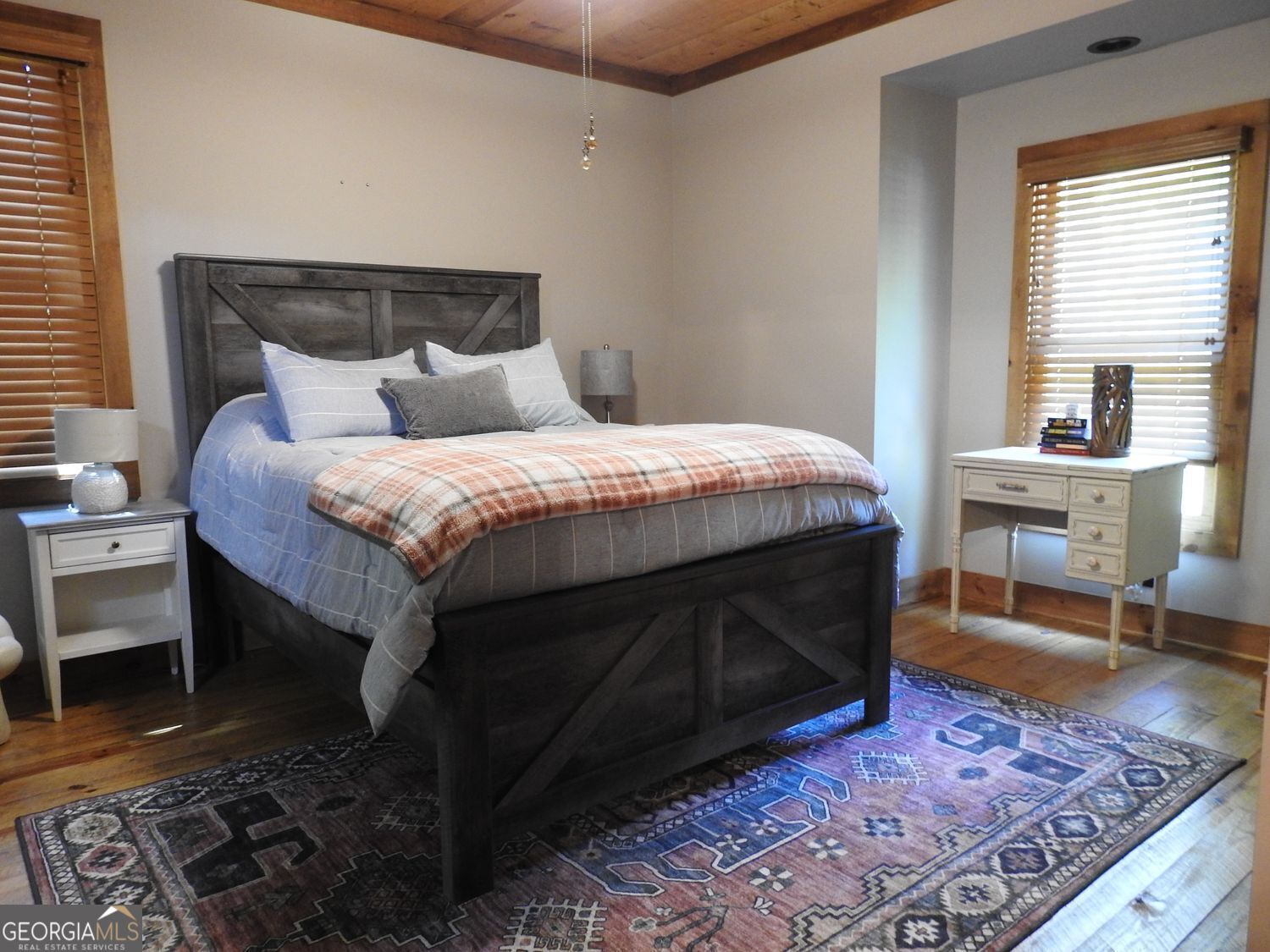 366 Shepherds Lane Morganton, GA 30560 - Photo 41 of 77 a bed sitting in a bedroom next to a window with chair