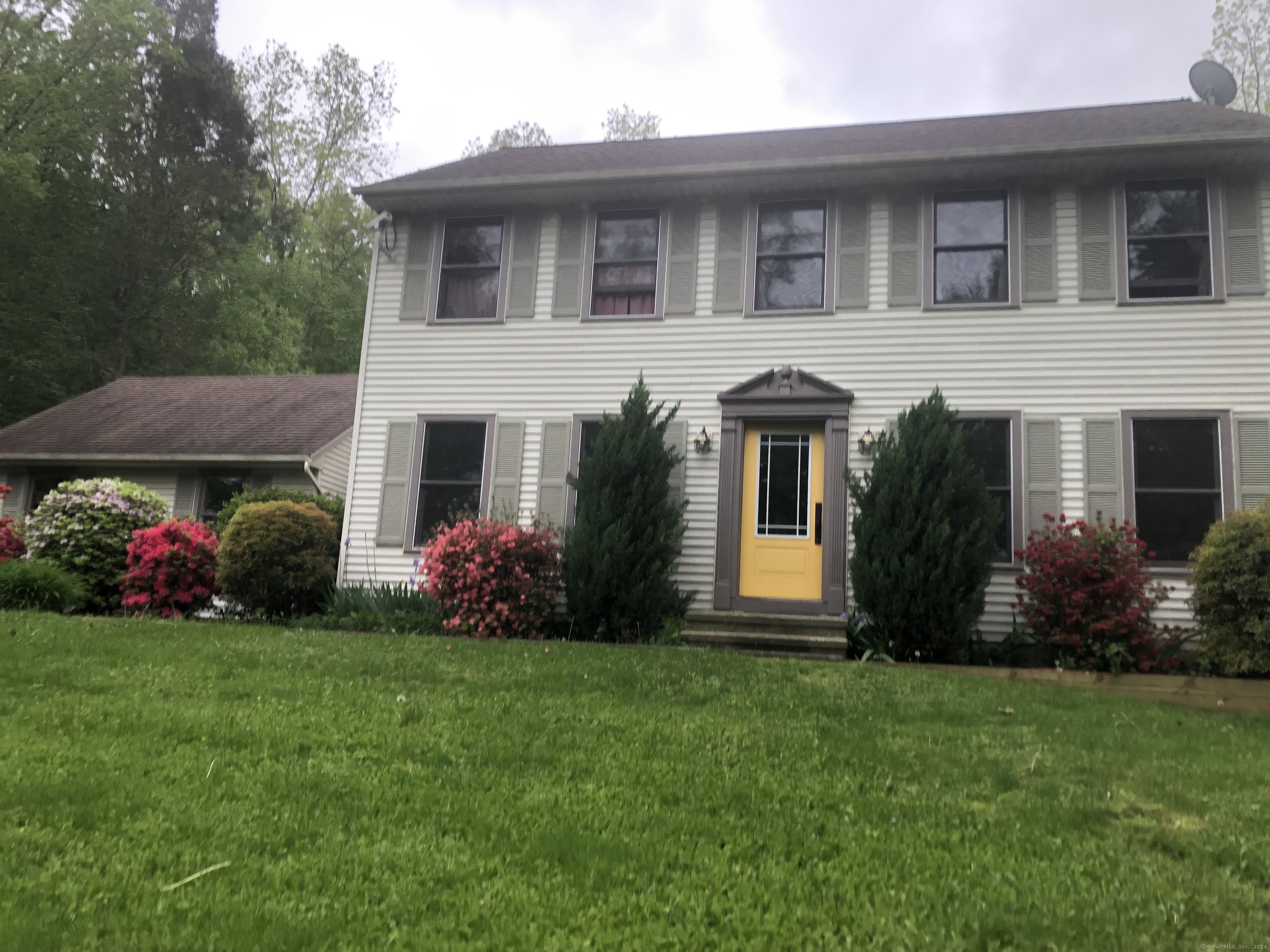 a front view of house with an outdoor space