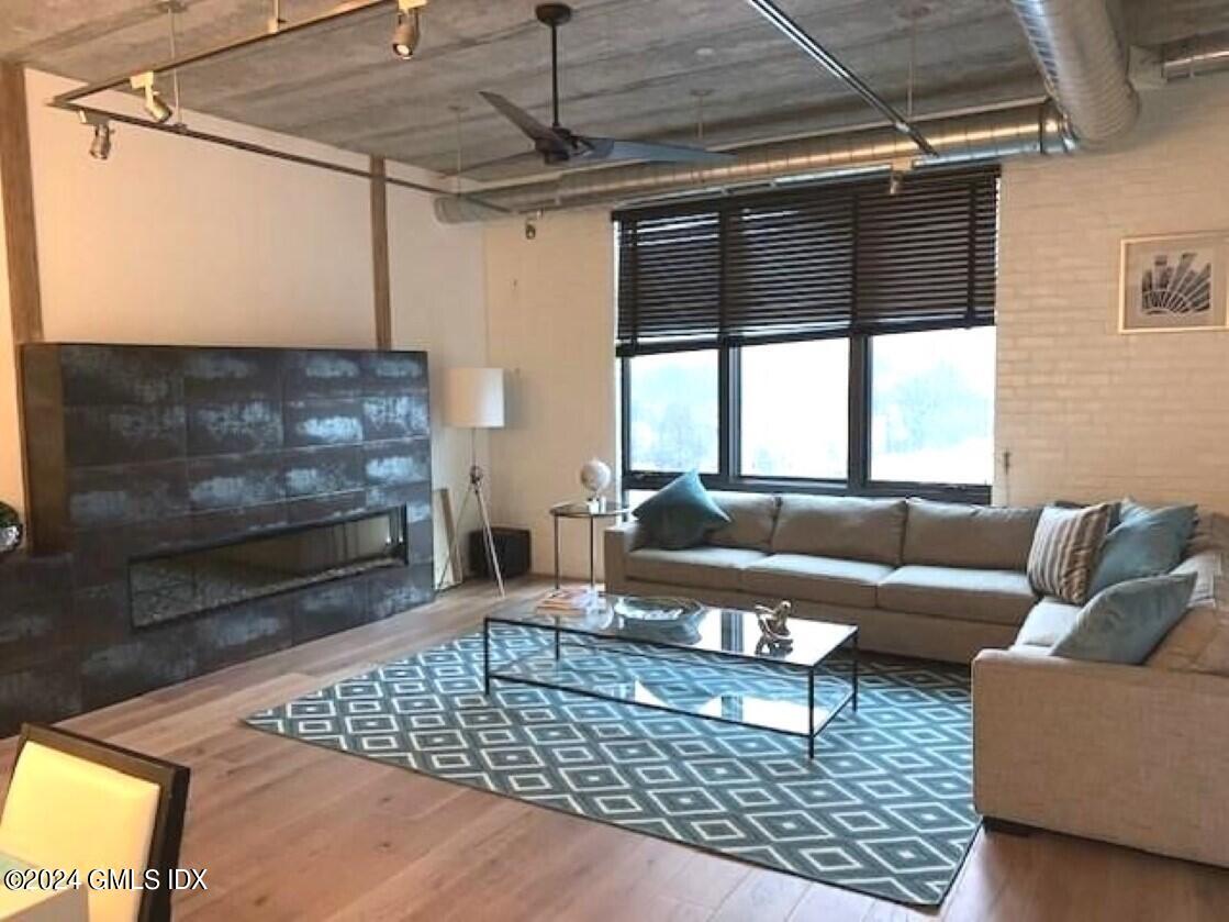 16 Old Track Road, Unit PH #3 Greenwich, CT 06830 - Photo 11 of 25 a living room with furniture and a rug