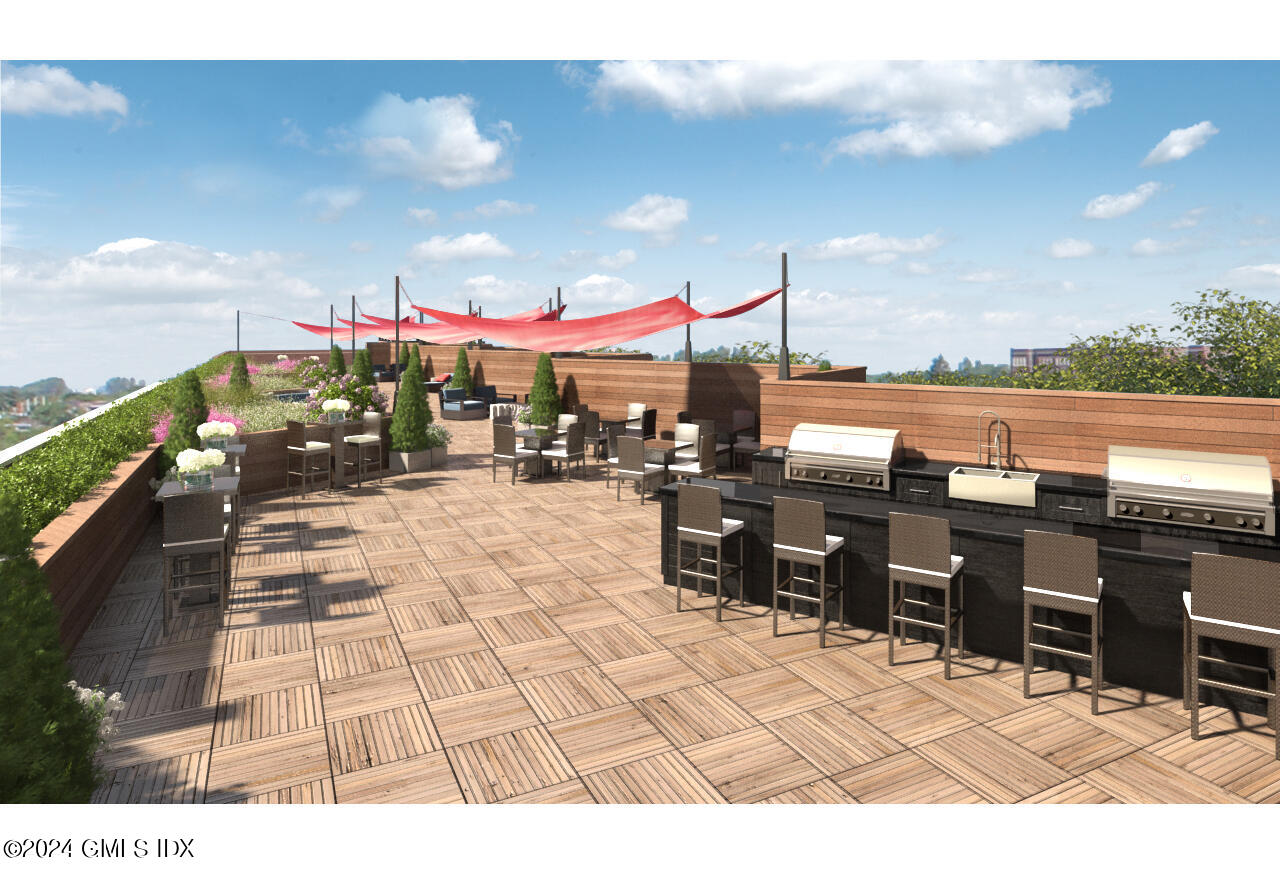 16 Old Track Road, Unit PH #3 Greenwich, CT 06830 - Photo 17 of 25 a view of a patio with a table and chairs