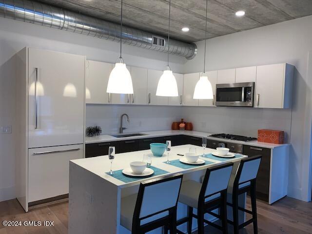 16 Old Track Road, Unit PH #3 Greenwich, CT 06830 - Photo 9 of 25 a kitchen with a sink and cabinets