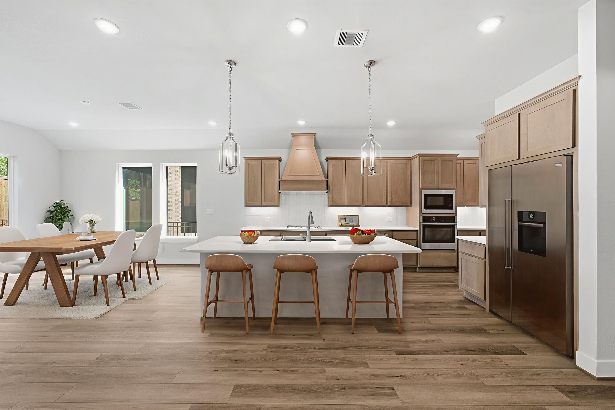 10026 Larkin Cove Willis, TX 77318 - Photo 9 of 46 a large kitchen with a table and chairs