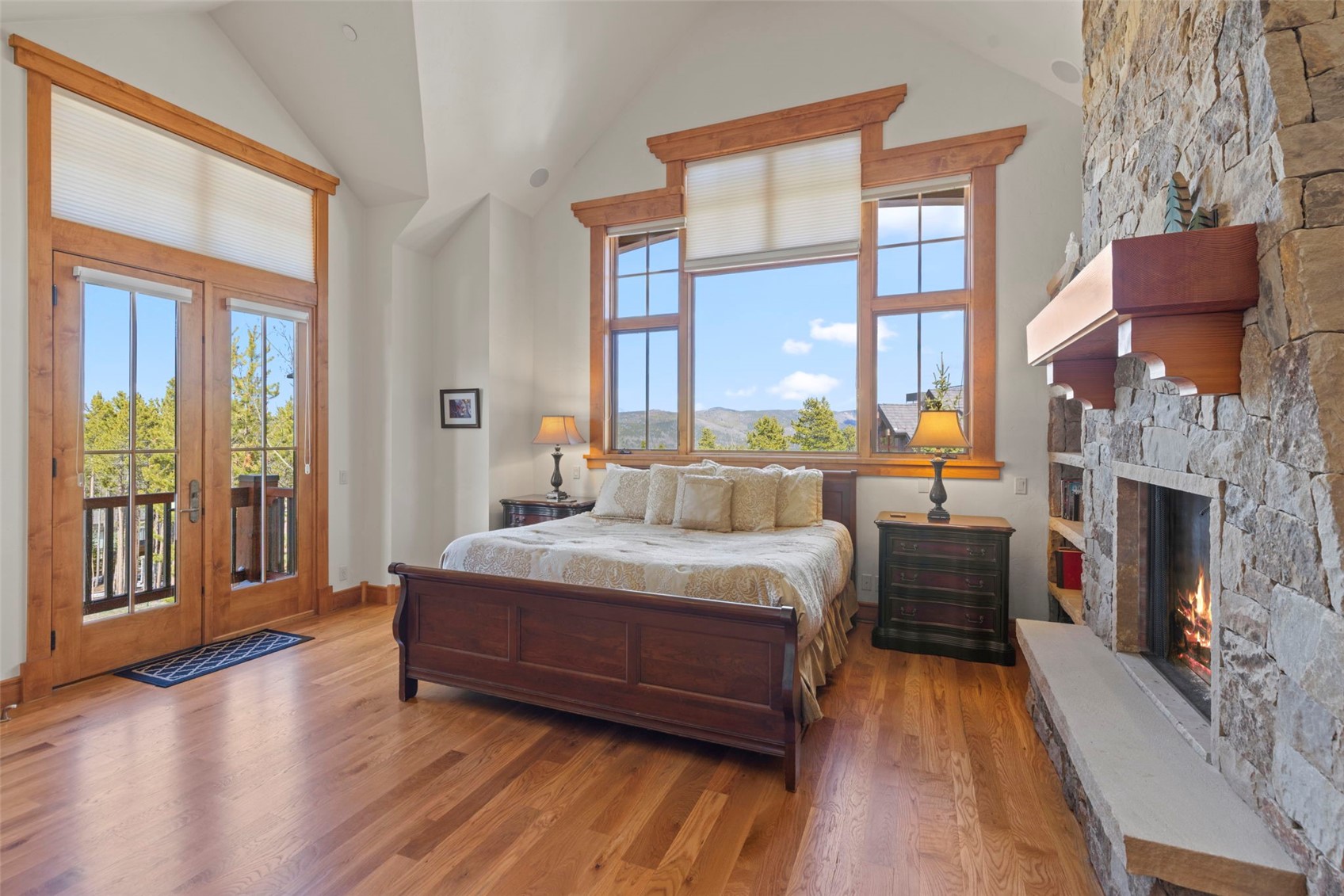 317 Timbertrail Road Breckenridge, CO 80424 - Photo 26 of 50 a bedroom with a bed and a fireplace