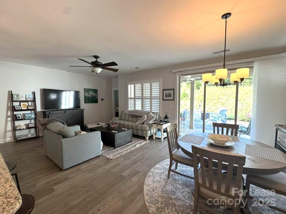 4995 Looking Glass Trail Denver, NC 28037 - Photo 13 of 32 a living room with furniture dining table and a large window