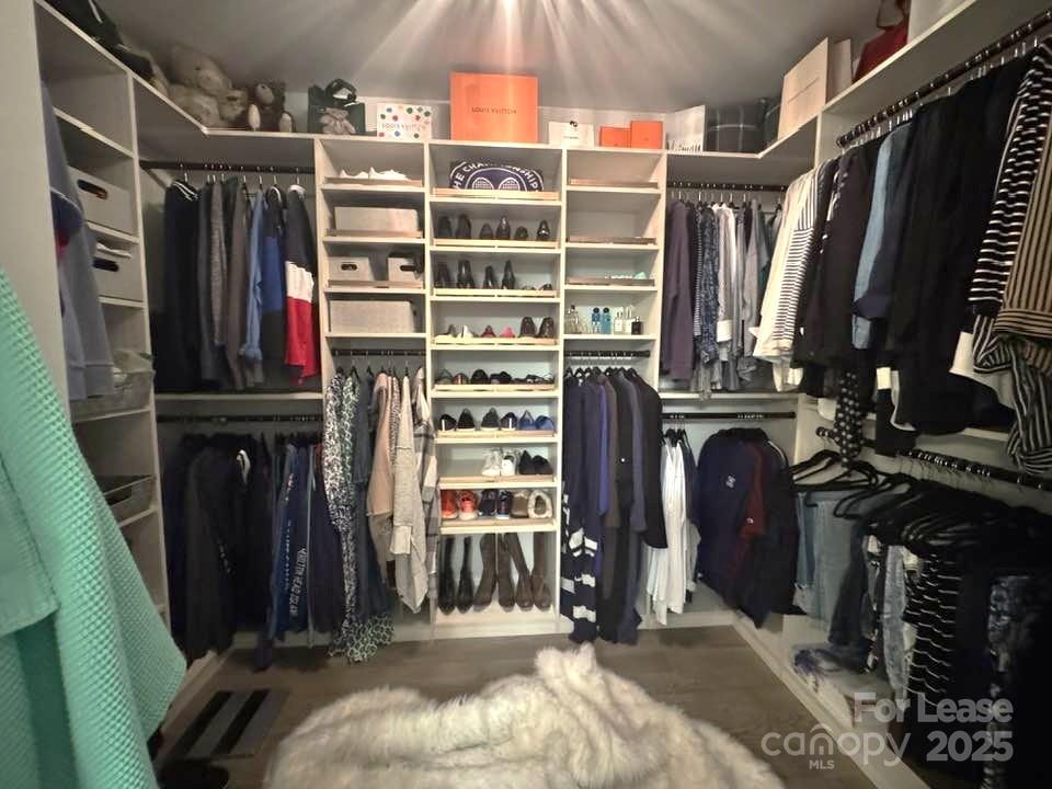 4995 Looking Glass Trail Denver, NC 28037 - Photo 19 of 32 a view of walk in closet with clothes and shoes