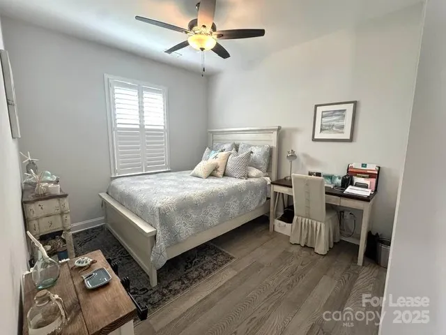 a bathroom with a double vanity sink toilet mirror and shower