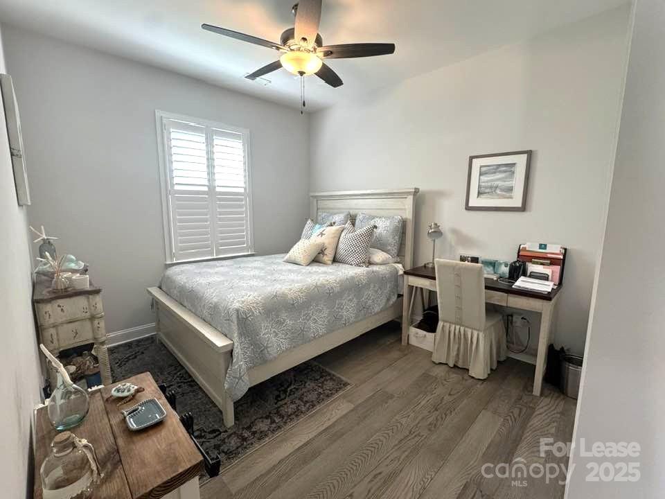 4995 Looking Glass Trail Denver, NC 28037 - Photo 24 of 32 a bedroom with a bed and a chandelier