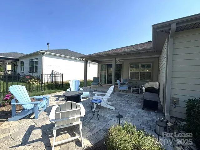 a view of a chairs and table in the patio