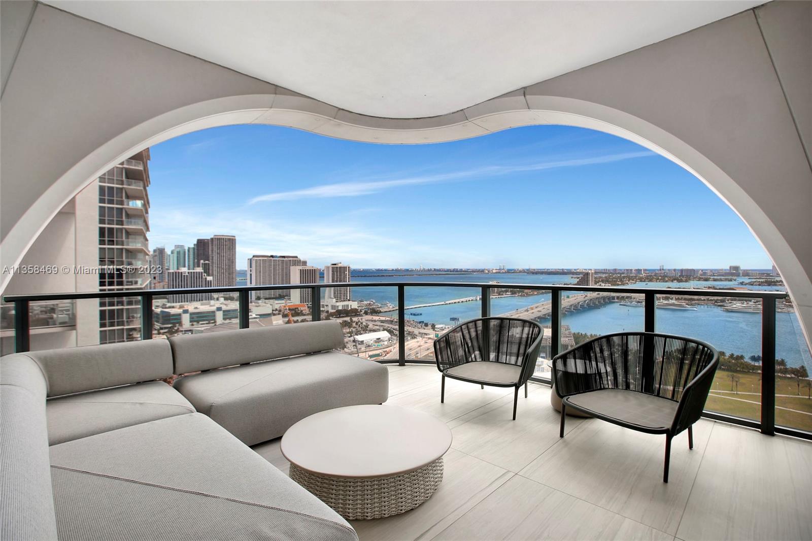 1000 Biscayne Boulevard, Unit 2802 Miami, FL 33132 - Photo 11 of 38 a balcony with furniture and a potted plant