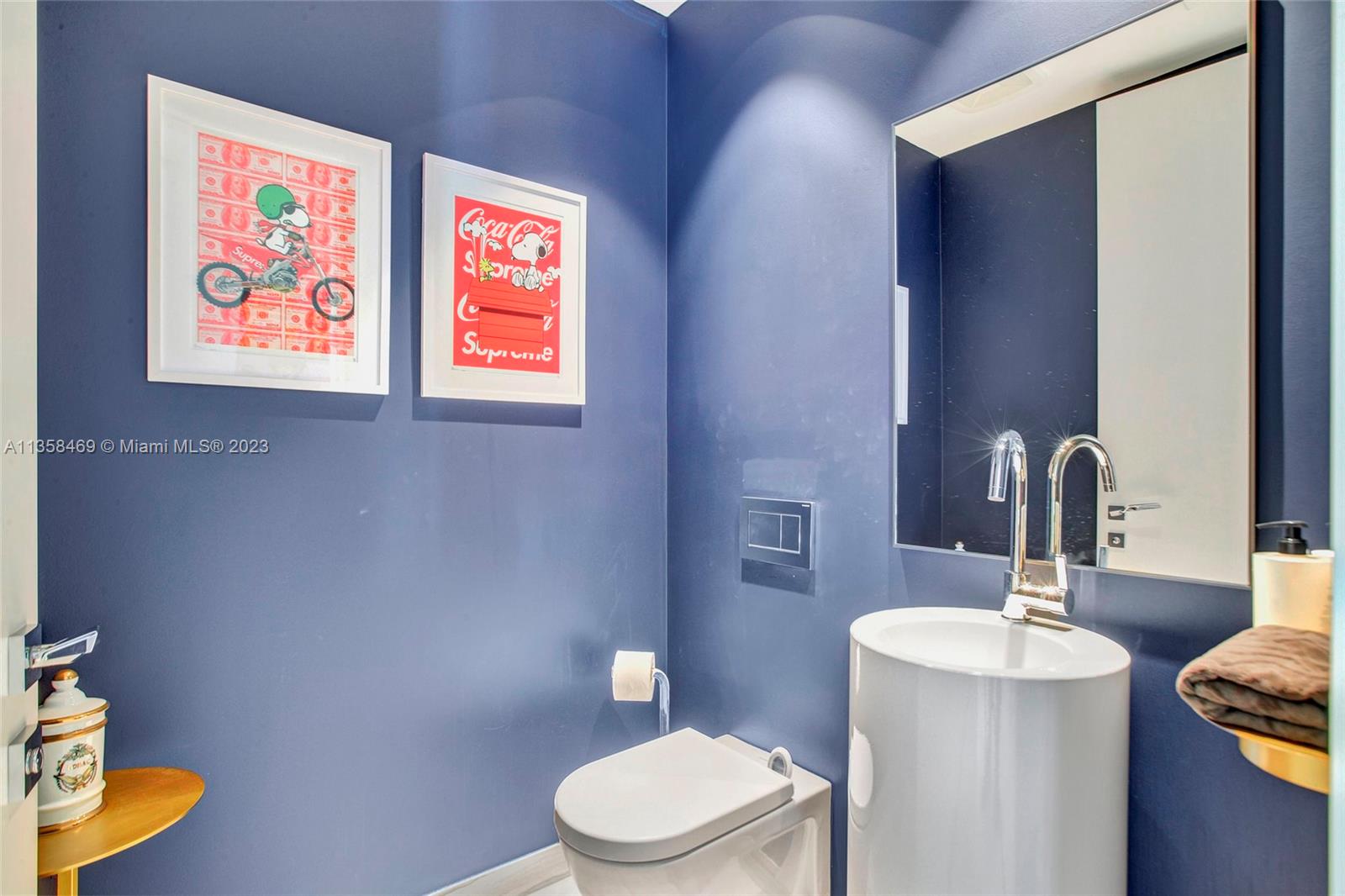 1000 Biscayne Boulevard, Unit 2802 Miami, FL 33132 - Photo 19 of 38 a bathroom with a toilet a sink and mirror